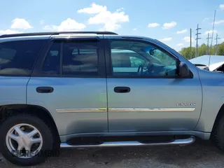 2006 GMC Envoy SLE with VIN 1GKDS13S362310613, listed as a IAAI auction lot 41881880 with 202,893 mi miles. Bid and sale history available at carsss.com. Image 13.
