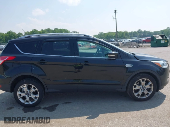 2015 Ford Escape Titanium with VIN 1FMCU9J96FUB58519, listed as a IAAI auction lot 42429369 with 125,541 mi miles and . Bid and sale history available at DreamBid. Image 13.