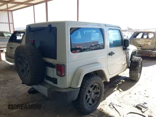 2015 Jeep Wrangler Altitude z VIN 1C4GJWBG2FL714146, wystawiony jako IAAI lot #41417659 z przebiegiem Nie podano mil oraz . Historia ofert i sprzedaży dostępna na DreamBid. Obrazek 4.