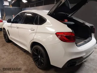 2019 BMW X6 sDrive35i with VIN 5UXKU0C5XK0S97686, listed as a IAAI auction lot 40436492 with 105,584 mi miles. Bid and sale history available at carsss.com. Image 3.
