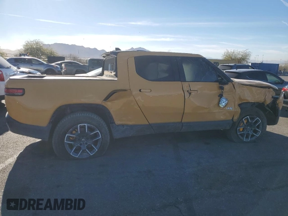 2022 Rivian R1T Launch Edition z VIN 7FCTGAAL2NN011755, wystawiony jako Copart lot #81940684 z przebiegiem Nie podano mil oraz Szkoda całkowita • Salvage title. Historia ofert i sprzedaży dostępna na DreamBid. Obrazek 3.