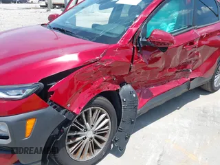 2021 Hyundai Kona SEL with VIN KM8K22AA8MU601480, listed as a IAAI auction lot 39589701 with 55,876 mi miles and . Bid and sale history available at carsss.com. Image 6.