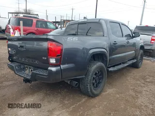 2023 Toyota Tacoma SR with VIN 3TYCZ5AN5PT138770, listed as a IAAI auction lot 41461423 with 19,785 mi miles and . Bid and sale history available at DreamBid. Image 4.