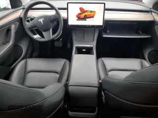 2023 Tesla Model Y Long Range z VIN 7SAYGDEE3PF751019, wystawiony jako Copart lot #57972885 z przebiegiem 24 591 mil mil oraz Szkoda całkowita • Salvage title. Historia ofert i sprzedaży dostępna na DreamBid. Obrazek 8.