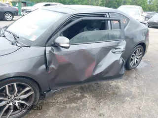 2015 Scion tC z VIN JTKJF5C75F3089895, wystawiony jako IAAI lot #42226465 z przebiegiem 106 694 mil mil oraz . Historia ofert i sprzedaży dostępna na DreamBid. Obrazek 6.
