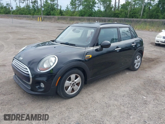 2015 MINI Hardtop 4 Door z VIN WMWXS5C58FT828427, wystawiony jako IAAI lot #42395620 z przebiegiem 102 282 mil mil oraz . Historia ofert i sprzedaży dostępna na DreamBid. Obrazek 2.
