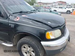 2002 Ford F-150 XLT with VIN 1FTRW08L72KD27457, listed as a IAAI auction lot 41993148 with 372,589 mi miles. Bid and sale history available at carsss.com. Image 6.