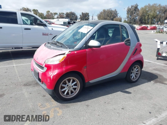 2009 Smart fortwo Pure z VIN WMEEJ31X59K245895, wystawiony jako IAAI lot #42266793 z przebiegiem 120 497 mil mil oraz . Historia ofert i sprzedaży dostępna na DreamBid. Obrazek 2.
