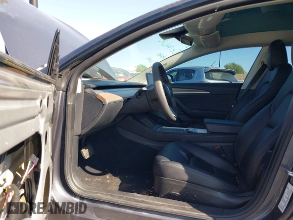 2023 Tesla Model 3 with VIN 5YJ3E1EA2PF640289, listed as a IAAI auction lot 42000200 with 14,194 mi miles and . Bid and sale history available at DreamBid. Image 5.