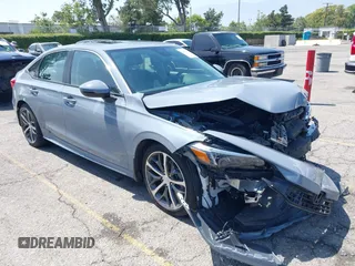 2024 Honda Civic Touring with VIN 2HGFE1F98RH322905, listed as a IAAI auction lot 42470472 with 14,616 mi miles and . Bid and sale history available at DreamBid. Image 1.