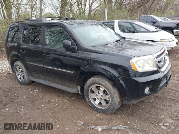2009 Honda Pilot Touring with VIN 5FNYF48959B016978, listed as a IAAI auction lot 41947782 with 234,115 mi miles and . Bid and sale history available at carsss.com. Image 1.