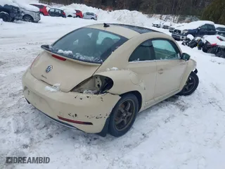 2019 Volkswagen Beetle S with VIN 3VWFD7AT1KM703684, listed as a IAAI auction lot 41571691 with 111,180 mi miles. Bid and sale history available at carsss.com. Image 4.