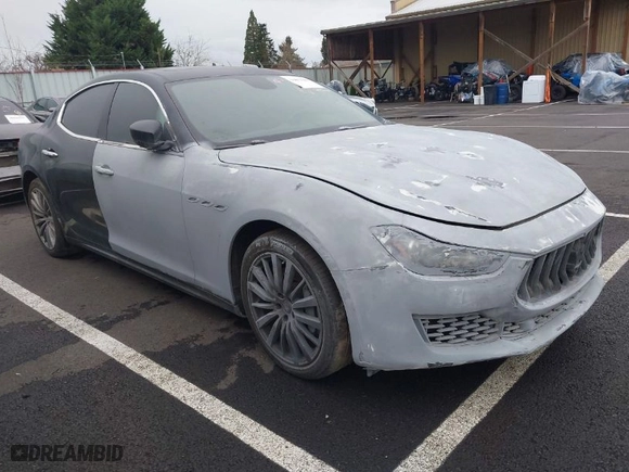 2018 Maserati Ghibli with VIN ZAM57XSA8J1284730, listed as a IAAI auction lot 39871081 with 32,908 mi miles. Bid and sale history available at carsss.com. Image 1.