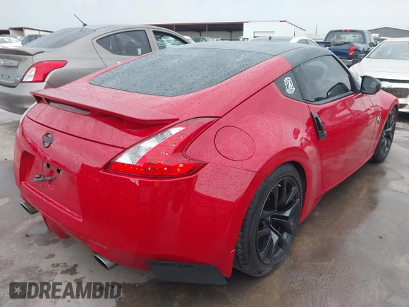 2016 Nissan 370Z z VIN JN1AZ4EHXGM932681, wystawiony jako IAAI lot #42350850 z przebiegiem 94 586 mil mil oraz . Historia ofert i sprzedaży dostępna na DreamBid. Obrazek 4.