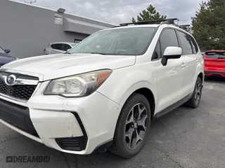 2014 Subaru Forester 2.0XT Premium with VIN JF2SJGDC1EH477436, listed as a Copart auction lot 54798465 with 124,807 mi miles and Clean Title. Bid and sale history available at carsss.com. Image 2.
