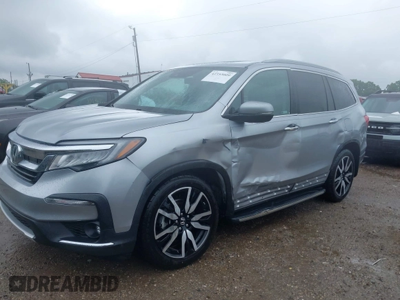 2019 Honda Pilot Touring 8-Passenger with VIN 5FNYF6H98KB097105, listed as a IAAI auction lot 42353009 with 133,212 mi miles and . Bid and sale history available at DreamBid. Image 17.