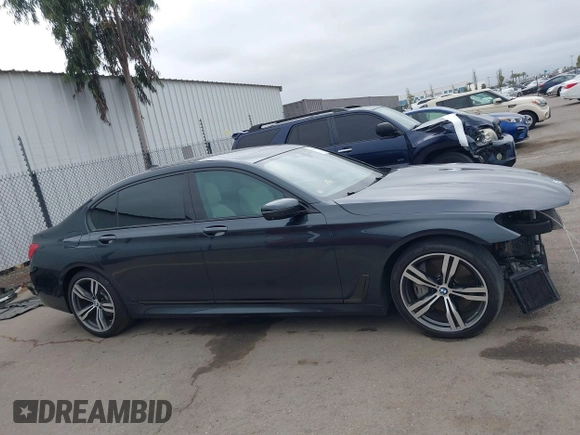 2019 BMW 7 Series 750i with VIN WBA7F0C50KGM26010, listed as a IAAI auction lot 42188421 with 71,576 mi miles and . Bid and sale history available at DreamBid. Image 14.