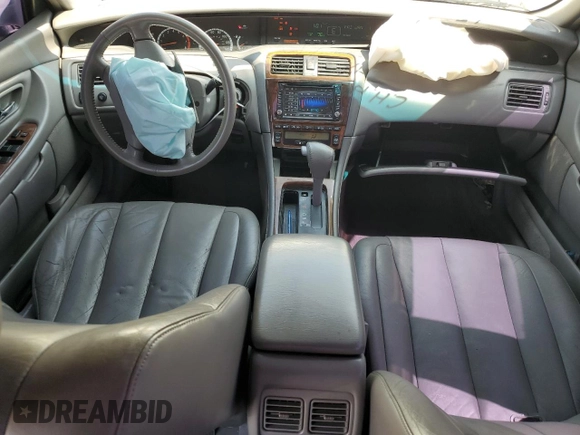 2000 Toyota Avalon XL with VIN 4T1BF28B9YU068001, listed as a Copart auction lot 54958915 with 240,232 mi miles and Salvage Title. Bid and sale history available at DreamBid. Image 8.