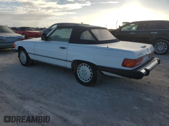 1989 Mercedes-Benz 560 SL z VIN WDBBA48DXKA096297, wystawiony jako Copart lot #75597074 z przebiegiem 70 152 mil mil oraz Szkoda całkowita • Salvage title. Historia ofert i sprzedaży dostępna na DreamBid. Obrazek 2.