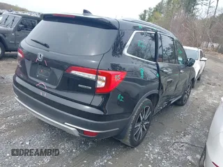 2019 Honda Pilot Touring 7-Passenger z VIN 5FNYF5H66KB027960, wystawiony jako IAAI lot #41863212 z przebiegiem 114 615 mil mil oraz . Historia ofert i sprzedaży dostępna na DreamBid. Obrazek 4.