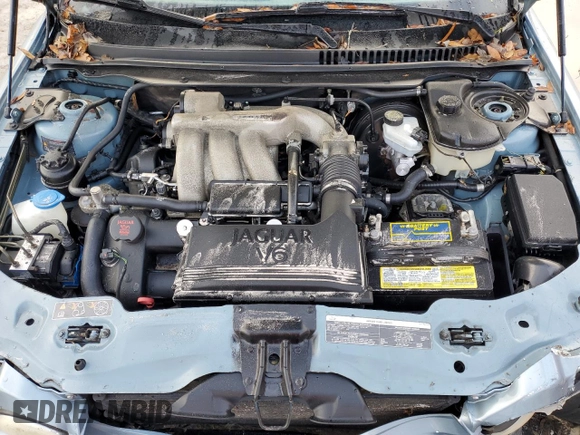 2004 Jaguar X-Type z VIN SAJEB52D54XD68737, wystawiony jako Copart lot #85168784 z przebiegiem 150 975 mil mil oraz Szkoda całkowita • Salvage title. Historia ofert i sprzedaży dostępna na DreamBid. Obrazek 13.