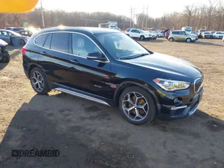 2017 BMW X1 xDrive28i with VIN WBXHT3Z33H4A65699, listed as a IAAI auction lot 41752257 with 66,306 mi miles. Bid and sale history available at carsss.com. Image 1.