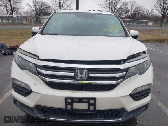 2016 Honda Pilot Touring with VIN 5FNYF6H95GB062089, listed as a IAAI auction lot 41810378 with 74,704 mi miles and . Bid and sale history available at DreamBid. Image 12.