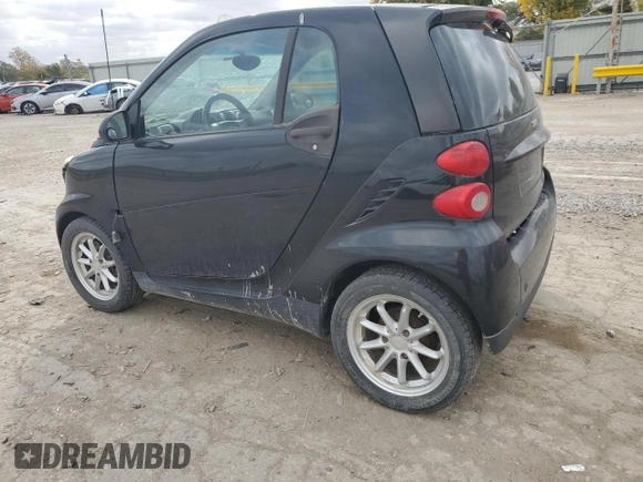 2009 Smart fortwo Pure with VIN WMEEJ31X19K267800, listed as a Copart auction lot 77392744 with 100,178 mi miles and Salvage Title. Bid and sale history available at carsss.com. Image 2.