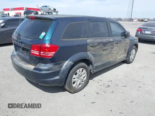 2014 Dodge Journey American Value Pkg with VIN 3C4PDCAB7ET101132, listed as a IAAI auction lot 41802381 with 101,895 mi miles. Bid and sale history available at carsss.com. Image 4.