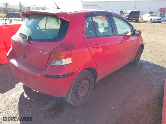 2009 Toyota Yaris with VIN JTDKT903495259976, listed as a IAAI auction lot 41670039 with 183,046 mi miles. Bid and sale history available at carsss.com. Image 4.