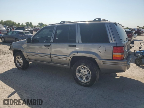 1998 Jeep Grand Cherokee Limited with VIN 1J4GZ78S5WC325148, listed as a Copart auction lot 67780424 with Not provided miles and Salvage title. Bid and sale history available at DreamBid. Image 2.