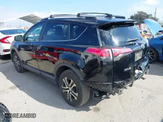 2018 Toyota RAV4 LE with VIN 2T3ZFREVXJW457751, listed as a IAAI auction lot 41529251 with 230,054 mi miles. Bid and sale history available at carsss.com. Image 3.