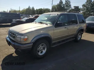 2000 Ford Explorer XLT z VIN 1FMDU83P1YZC26628, wystawiony jako Copart lot #69201664 z przebiegiem 219 384 mil mil oraz Nie do naprawy. Historia ofert i sprzedaży dostępna na DreamBid. Obrazek 1.