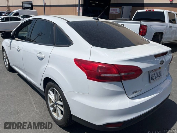 2018 Ford Focus SE z VIN 1FADP3F20JL259181, wystawiony jako IAAI lot #42400276 z przebiegiem 161 473 mil mil oraz . Historia ofert i sprzedaży dostępna na DreamBid. Obrazek 1.