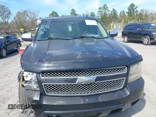 2013 Chevrolet Suburban LT with VIN 1GNSCJE07DR147780, listed as a IAAI auction lot 41666746 with 260,020 mi miles and . Bid and sale history available at DreamBid. Image 12.