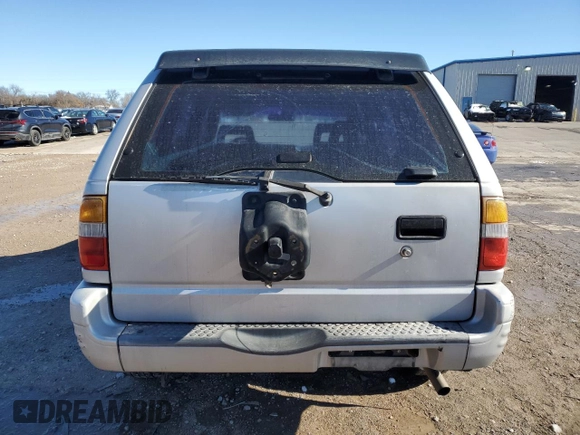 1999 Isuzu Rodeo S with VIN 4S2CK58WXX4373485, listed as a Copart auction lot 87804995 with 246,518 mi miles and Salvage title. Bid and sale history available at DreamBid. Image 6.