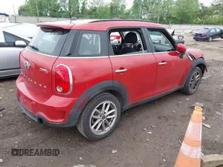 2015 MINI Countryman S with VIN WMWZC3C56FWP53249, listed as a IAAI auction lot 42256130 with 104,415 mi miles and . Bid and sale history available at DreamBid. Image 4.