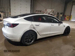 2021 Tesla Model 3 Standard Range Plus with VIN 5YJ3E1EA5MF987000, listed as a Copart auction lot 87638485 with Not Provided miles and Salvage Title. Bid and sale history available at DreamBid. Image 3.