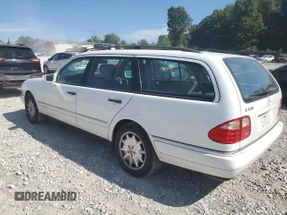 1999 Mercedes-Benz E-Class with VIN WDBJH65F1XA811693, listed as a Copart auction lot 69370604 with 128,876 mi miles and Salvage Title. Bid and sale history available at carsss.com. Image 2.