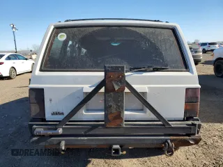 1996 Jeep Cherokee SE with VIN 1J4FJ28S0TL272778, listed as a Copart auction lot 83498634 with Not provided miles and Salvage title. Bid and sale history available at DreamBid. Image 6.