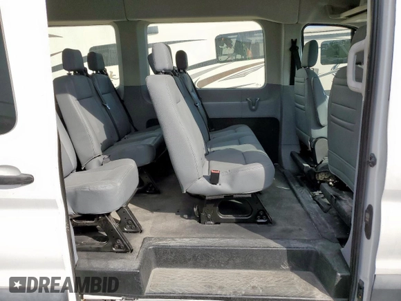 2018 Ford Transit Passenger XL z VIN 1FBAX2CM6JKA67593, wystawiony jako Copart lot #54932145 z przebiegiem 27 491 mil mil oraz Szkody całkowita. Historia ofert i sprzedaży dostępna na DreamBid. Obrazek 11.