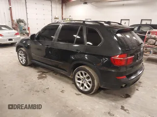 2012 BMW X5 35i with VIN 5UXZV4C55CL990510, listed as a IAAI auction lot 41849293 with 117,522 mi miles and . Bid and sale history available at DreamBid. Image 3.