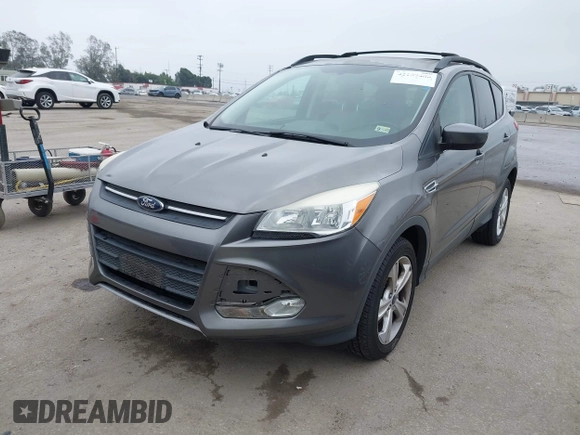 2014 Ford Escape SE with VIN 1FMCU9GX7EUC04296, listed as a IAAI auction lot 42159486 with 108,598 mi miles and . Bid and sale history available at DreamBid. Image 2.