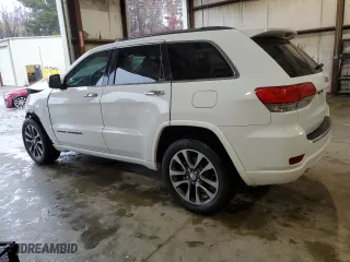 2017 Jeep Grand Cherokee Overland with VIN 1C4RJECG9HC965752, listed as a Copart auction lot 83874784 with 106,604 mi miles and Salvage Title. Bid and sale history available at carsss.com. Image 2.