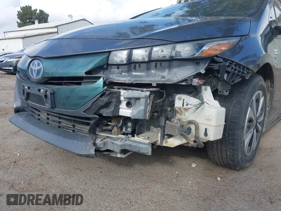 2018 Toyota Prius Plus with VIN JTDKARFPXJ3104302, listed as a IAAI auction lot 42127312 with 87,531 mi miles and . Bid and sale history available at DreamBid. Image 12.