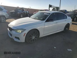 2014 BMW 3 Series 335i xDrive with VIN WBA3B9C50EF588115, listed as a Copart auction lot 76977484 with 185,131 mi miles and Salvage title. Bid and sale history available at DreamBid. Image 1.
