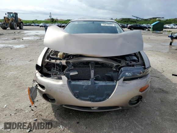 1999 Chrysler Sebring LXi z VIN 4C3AU52N9XE040835, wystawiony jako Copart lot #73418654 z przebiegiem 113 640 mil mil oraz Szkody całkowita. Historia ofert i sprzedaży dostępna na DreamBid. Obrazek 5.