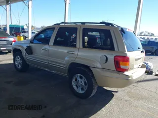 1999 Jeep Grand Cherokee Limited with VIN 1J4GW68NXXC727844, listed as a IAAI auction lot 41290773 with 222,838 mi miles. Bid and sale history available at carsss.com. Image 3.