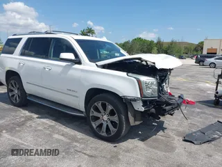 2015 GMC Yukon Denali z VIN 1GKS2CKJXFR527790, wystawiony jako IAAI lot #42315472 z przebiegiem 103 839 mil mil oraz . Historia ofert i sprzedaży dostępna na DreamBid. Obrazek 1.