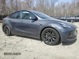 2022 Tesla Model Y Long Range with VIN 7SAYGDEE5NF366493, listed as a Copart auction lot 49874975 with 66,925 mi miles and Salvage Title. Bid and sale history available at DreamBid. Image 4.